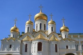 golden domes of Cathedral of the Annunciation at blue sky, russia, moscow