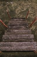 weathered wooden stairs down