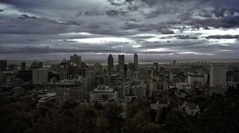 city at dusk under grey clouds, skyline, canada, montreal