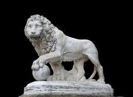 lion with ball, marble statue in villa medici, italy, rome