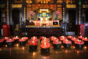 burning red candles in temple, china