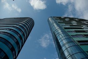 low angle view of two high modern buildings at sky