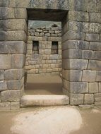 doorway in ancient stone wall, peru, machu picchu