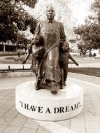 martin luther king with kids, statue in park, usa