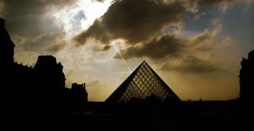 pyramid near the Louvre on a background of clouds