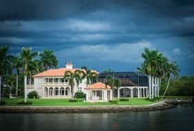 beautiful residential buildings and palm trees at water, usa, florida