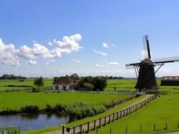 scenic spring countryside landscape with windmill, netherlands