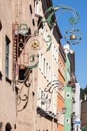 vintage forged advertising sign on facade of restaurant, germany, wasserburg