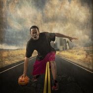 angry basketball player with ball on road in view of city, collage