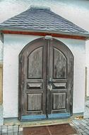 Wooden door at the entrance of old church in Germany