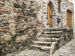 stairs on pavement at entrance door of old stone house, austria, Krems an der Donau