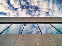 reflection of sky with clouds on windows