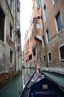 gondola on narrow channel, italy, venice