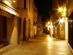 old houses on winding street at night, spain, mallorca