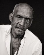 old dark skin man in white shirt, portrait