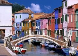 boats on channel at colorful old houses, italy, venice