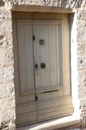 old wooden door at house facade