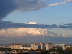 clouds above city at evening after the rain