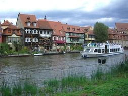 ship on regnitz river at truss houses, germany, bamberg