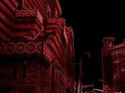 Black and red photo of city buildings