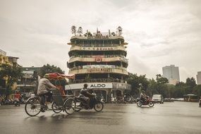 trishaw on road in city, vietnam, hanoi