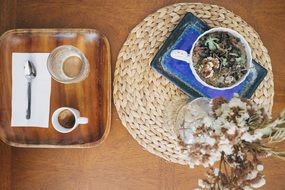 coffe and flowers on table, top view