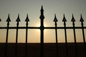 top of old forged fence at sky