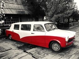 vintage red white car on street in monochrome