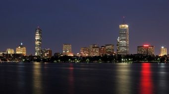 night skyline with colorful reflection on water, usa, massachusetts, boston