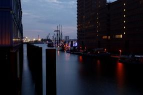 ships in port on elbe river at dusk, germany, hamburg