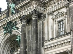 fragment of old facade with columns and sculptures, germany, berlin