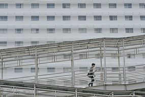pedestrian on covered staircase in city, indonesia, jakarta
