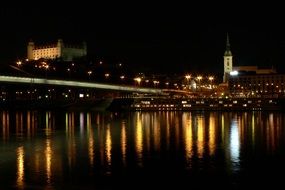 night view of castle at danube river, slovakia, bratislava