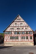 architecture truss home building white red striples facade