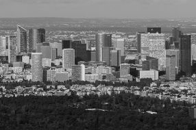 Black and white photo of la defense district in cityscape, france, paris