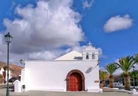small white church in old tropical town, spain, lanzarote, la geria