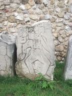 ancient stone ruin with carving, mexico, oaxaca