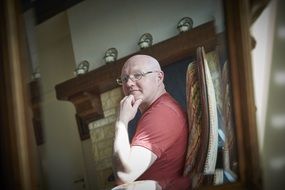 portrait of bald middle aged man at home