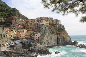 picturesque coastal village on cliff, italy, liguria, cormiglia