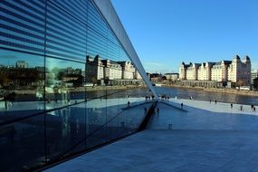 blue glass facade of opera house, norway, oslo