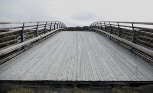 wooden bridge crossing road