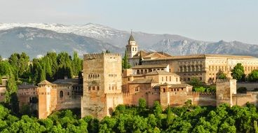 Alhambra, palace and fortress complex at snow-capped mountains,spain, granada