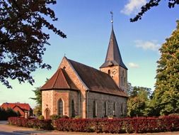 brick church building in park, germany, velpke