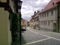 alley with cobblestone pavement in old town