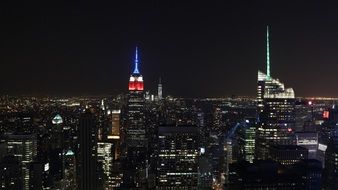 illuminated skyscrapers in night cityscape, usa, manhattan, new york city