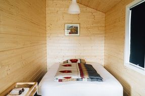 small bedroom in log cabin