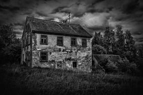 black white photo ailing mill uninhabited building