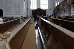 old wooden pews in church interior