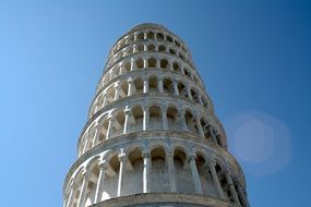 low angle view of leaning tower at clear blue sky, italy, pisa