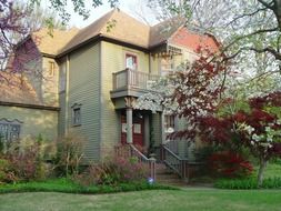 beautiful house in blooming garden at spring, usa, arkansas, fayetteville